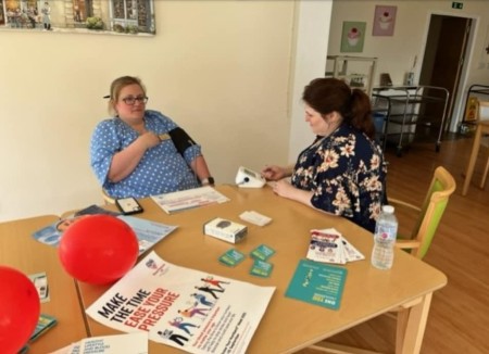 person having blood pressure checked