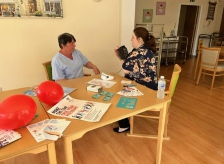 person having blood pressure checked